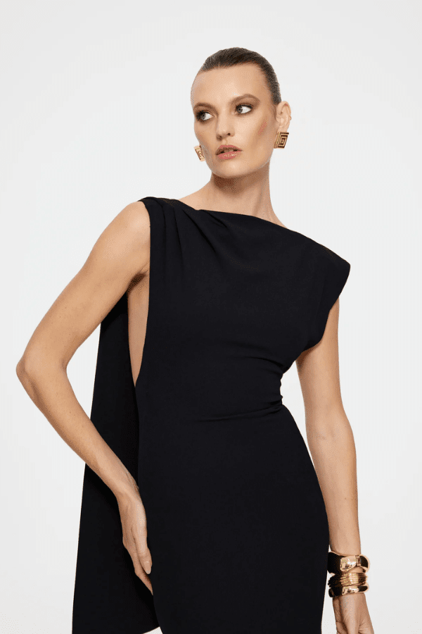 Audrey Gown Black by Effie Kats – A stretch-crepe gown with a straight neckline and dramatic low back, perfect for black-tie affairs, red carpet moments, or elegant evening events.
