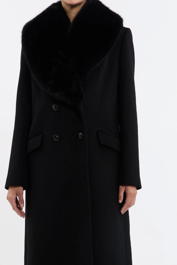 Biera Coat Black by Rebecca Vallance – A boxy, double-breasted wool coat with flap pockets, embossed dome buttons, and removable faux fur trim. Fully lined for comfort.