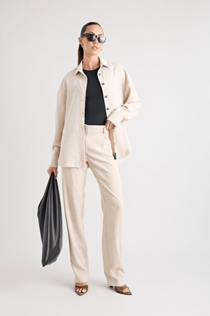 Pino Trouser natural by Pfeiffer, mid-rise tailored pants with front pleats and side pockets, perfect for day-to-night wear and office to evening events.