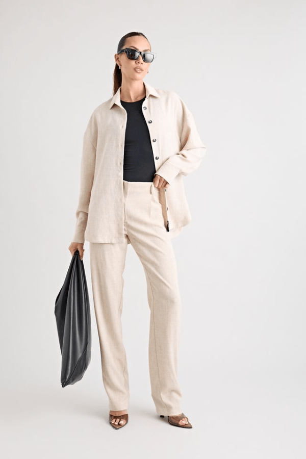 Pino Trouser natural by Pfeiffer, mid-rise tailored pants with front pleats and side pockets, perfect for day-to-night wear and office to evening events.