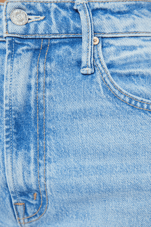 The Lasso Sneak Sow Surreal by MOTHER, trendy super high-rise wide-leg jeans with a light blue wash, whiskering, and fading. Perfect for a vintage-inspired look with a clean hem and structured fit.