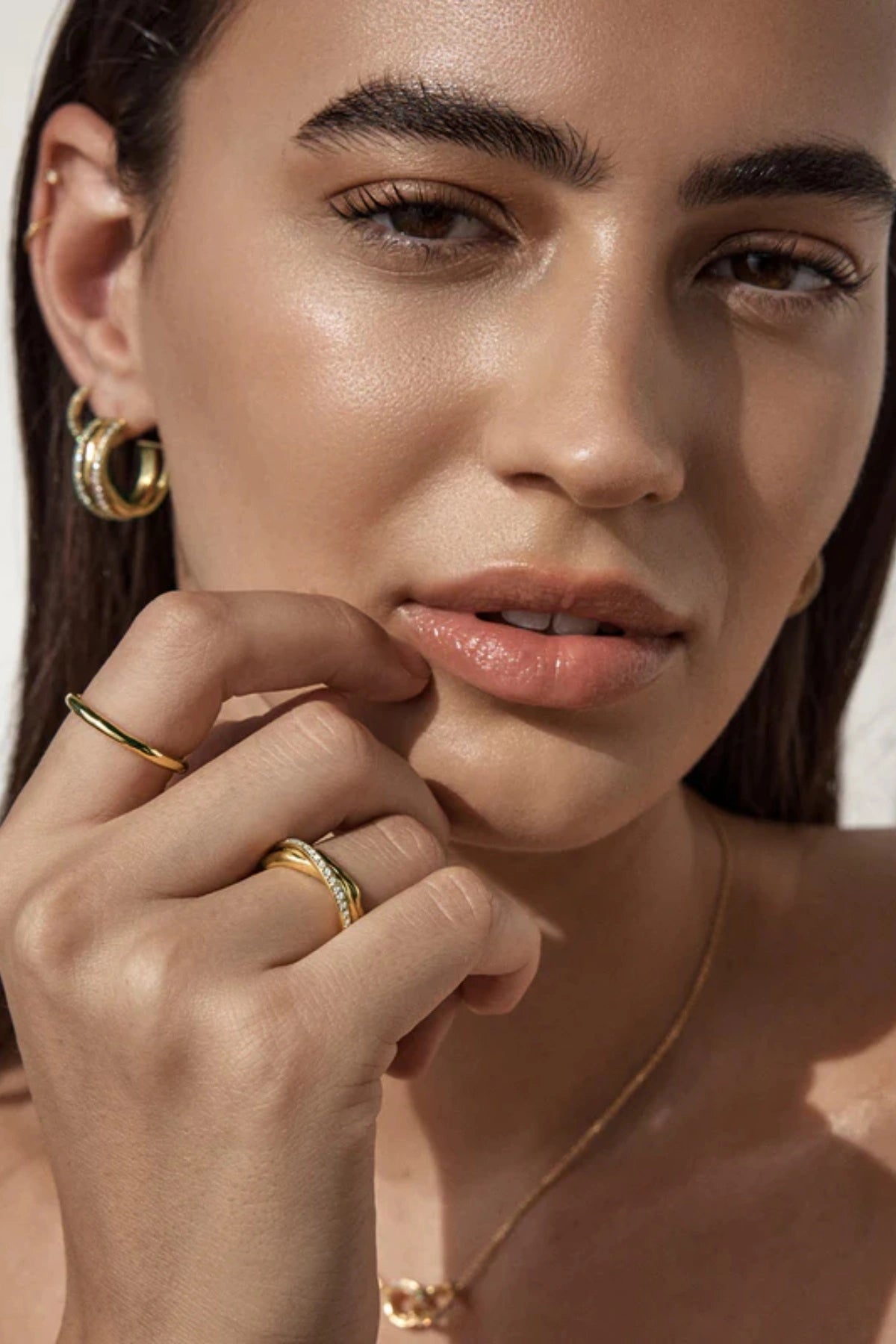 Entwined Hearts Ring by By Charlotte — a sterling silver double-band ring with CZ crystals, symbolising intertwined love and timeless elegance.