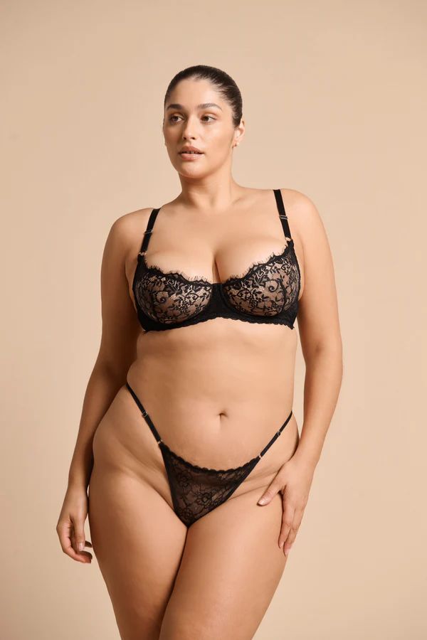 Rosie Thong in Black by Kat the Label, high-cut lace thong with a soft mesh back and adjustable waistband, perfect for comfort and a touch of luxe elegance.