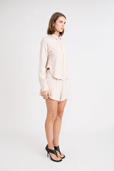 Pino Tailored Short by Pfeiffer — a lightweight mid-rise short with a curved hem and clean tailored finish, ideal for polished daytime looks.
