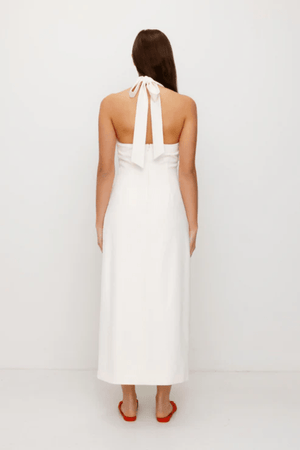Irida Maxi Dress Ivory by The Wolf Gang – A trendy fitted maxi with halter neckline and gold swirl details, perfect for timeless elegance at special occasions.