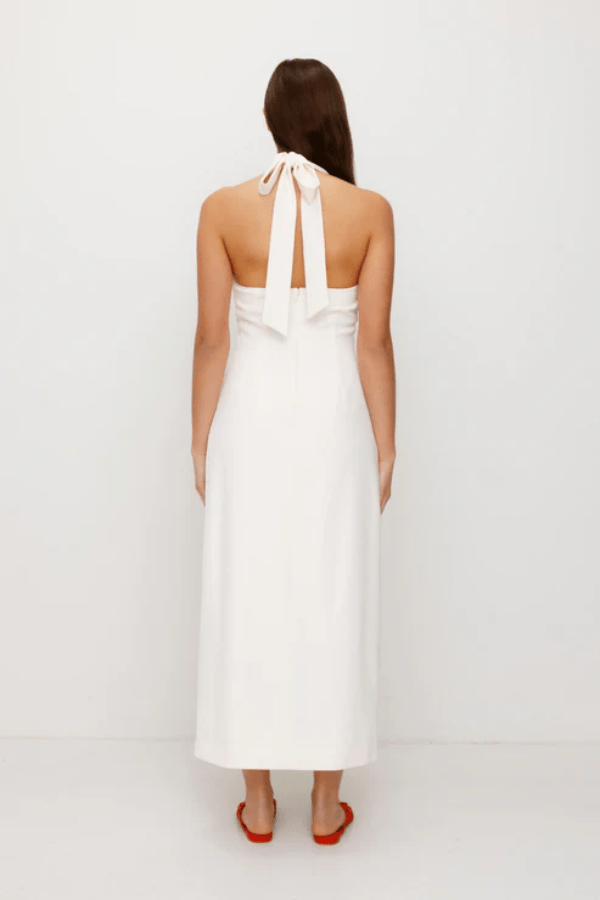 Irida Maxi Dress Ivory by The Wolf Gang – A trendy fitted maxi with halter neckline and gold swirl details, perfect for timeless elegance at special occasions.