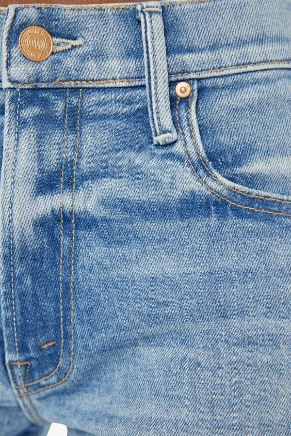 Mid Rise Maven Sneak Peak A Boo by Mother Denim, mid-rise relaxed wide-leg jeans with distressed knees, light-blue wash, perfect for casual cool style.