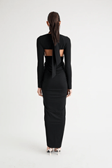 Victoria Maxi Dress Black by Pfeiffer – A sleek, versatile maxi with adjustable halter, removable shrug, and ruching, perfect for elegant, adaptable style.