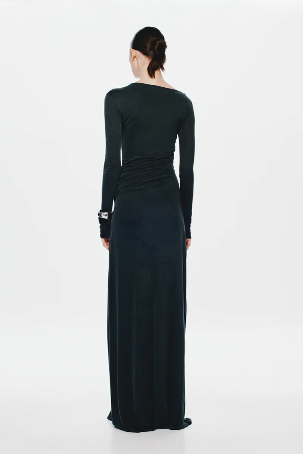 The 'Glacier' Long Sleeve Dress Black by MISHA, full-length black maxi with sculptural draping, high boat neckline, asymmetrical pleats, dry clean only.