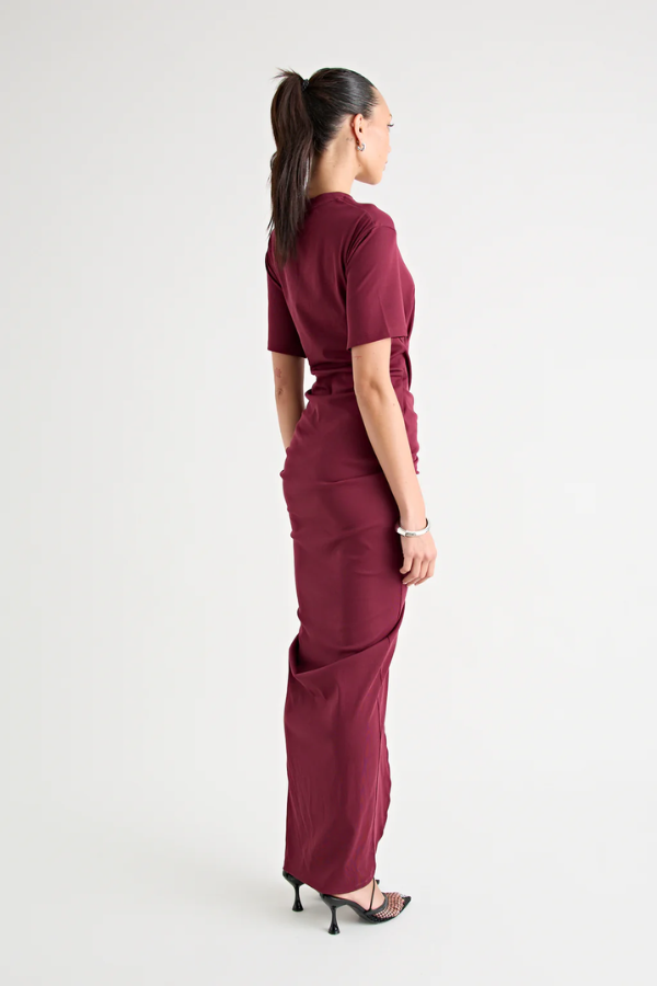 Niko Maxi Dress Burgundy by Pfeiffer – Trendy relaxed T-shirt maxi with adjustable side ruching, crew neck, and breathable cotton blend, perfect for elevated off-duty style and everyday comfort.