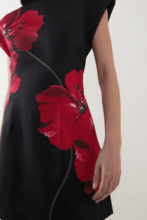 Chaya Mini Poppy Print Black Base by Rebecca Vallance – A trendy structured A-line mini with floral poppy print, round neckline, and dropped shoulders, perfect for special occasions or elevating everyday style with a polished, feminine touch.
