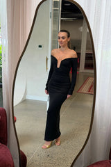Black Haley off-shoulder midi dress with fitted bodice and flowy skirt, featuring short sleeves and a subtle slit.