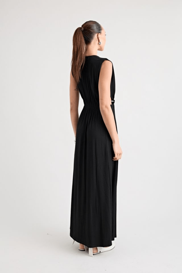 Do For Love Gown Black by Pfeiffer – A trendy, elegant low-plunge maxi with bold hardware and thigh-high split, perfect for special occasions and modern sophistication.