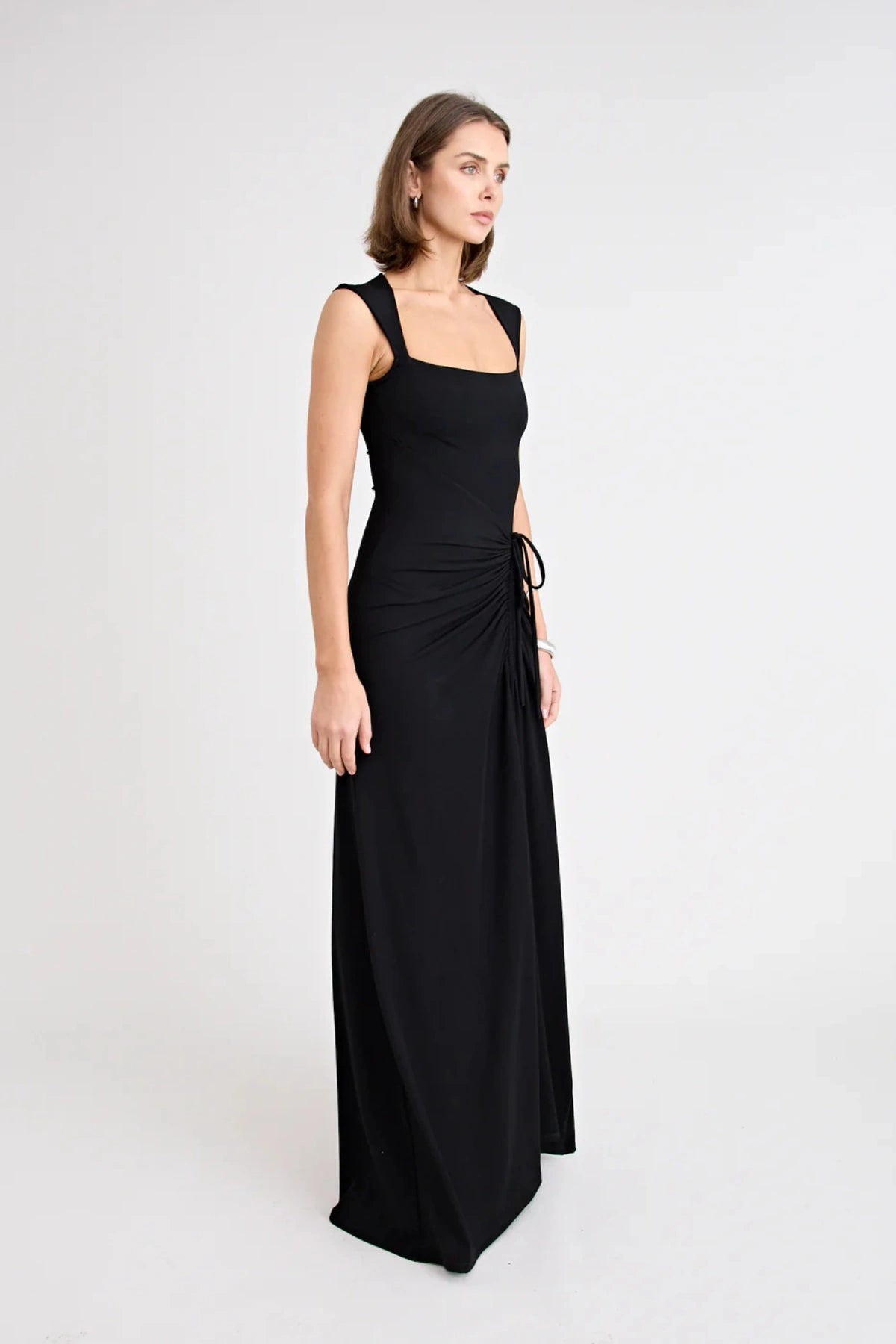 Samara Dress by Pfeiffer — a full-length jersey dress with a square neckline and adjustable front split, perfect for elegant occasions.