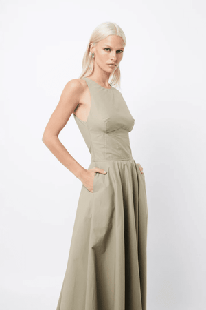 Homage Maxi Dress Eucalyptus by Mossman – A trendy, breathable cotton maxi with a flattering A-line flare and sleek design, perfect for stylish warm-weather days.