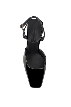 Lana Wilkinson Mona Wedge in black patent leather with pointed toe, high-cut vamp, ankle strap, and sculptural wedge heel.