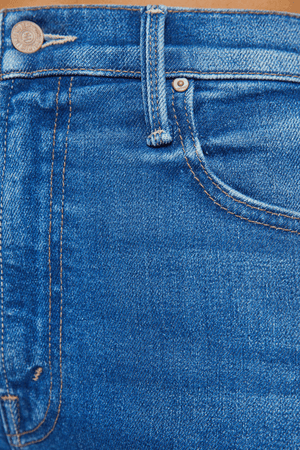 The Rambler Zip Flood Nip In The Bud by MOTHER, trendy high-rise jeans with a wide straight leg and cropped, clean hem. Perfect for a laid-back, polished look in mid-blue with subtle fading and whiskering.