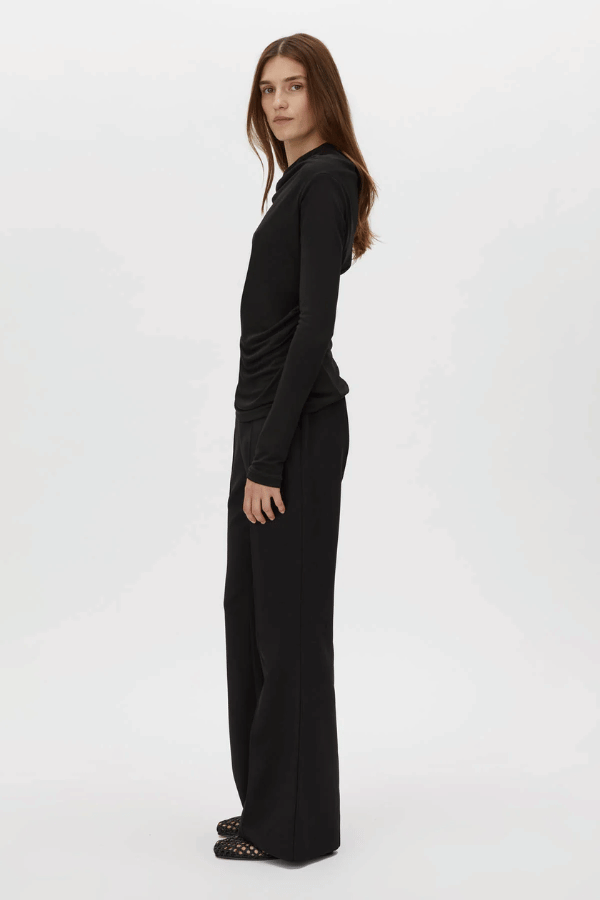 Mai Long Sleeve Top Black by Camilla and Marc – asymmetric twisted neckline with side tucks and sleek lining, perfect for elegant nights or polished day looks.