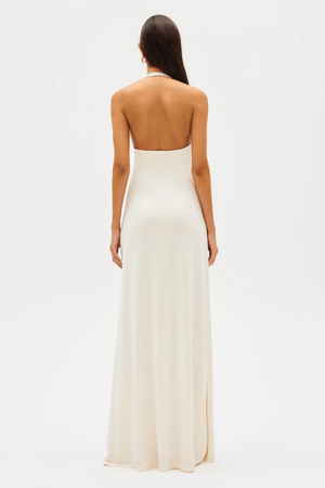 Jennifer Cupro Maxi Dress Ivory by Misha – A sleek and sophisticated maxi with a plunging halter neckline and dramatic sash, perfect for elegant day-to-night events.