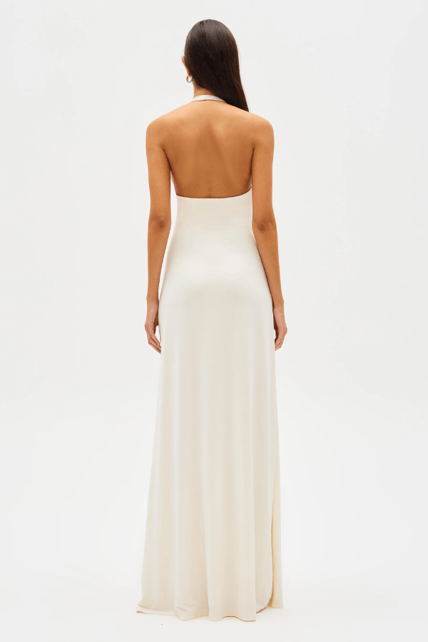 Jennifer Cupro Maxi Dress Ivory by Misha – A sleek and sophisticated maxi with a plunging halter neckline and dramatic sash, perfect for elegant day-to-night events.