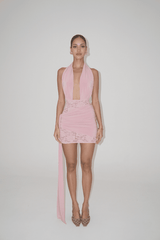 Chrissy Pink by Deconduarte – Trendy two-piece stretch lace set with fitted dress, dramatic over-belt skirt, and daring open back, perfect for bold, elegant formal events.