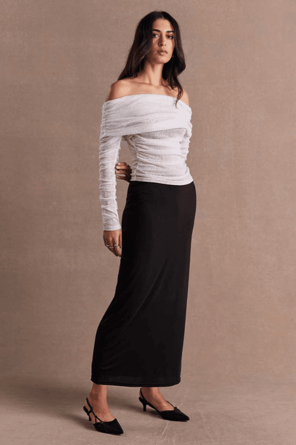 Emara Sleeveless Mini Dress Black by Sovere – fitted mini dress with pleats, keyhole neckline, tie details, and back zipper.