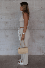 Charlie Pant Sand/White by Sneaky Link, trendy and comfortable low-rise pants with elastic waist and contrast drawcord, perfect for chic summer days and evenings.