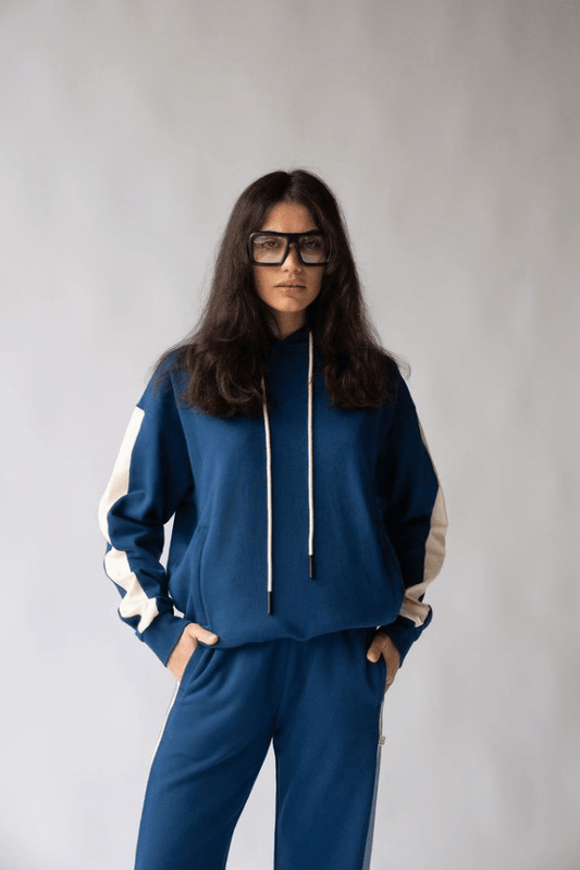 1984 Hoodie Estate Blue by Araminta James, soft cotton brushed fleece with contrast trim and velvet graphic, relaxed fit perfect for casual cool days.