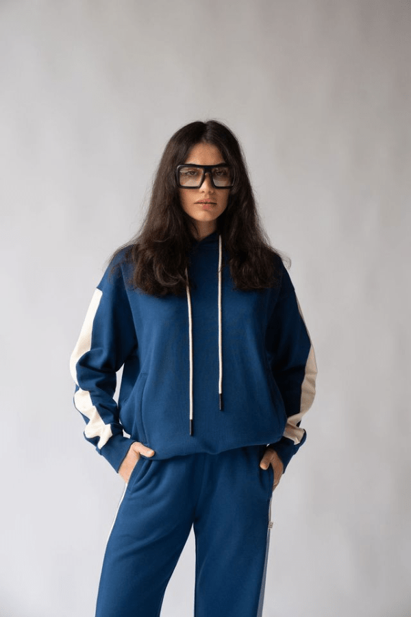 1984 Hoodie Estate Blue by Araminta James, soft cotton brushed fleece with contrast trim and velvet graphic, relaxed fit perfect for casual cool days.