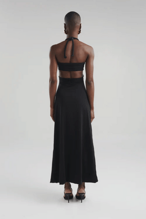 Migramah Black by Maygel Coronel – Draped dress with handmade knot, waist cutout, and shirred hips for flattering fit.
