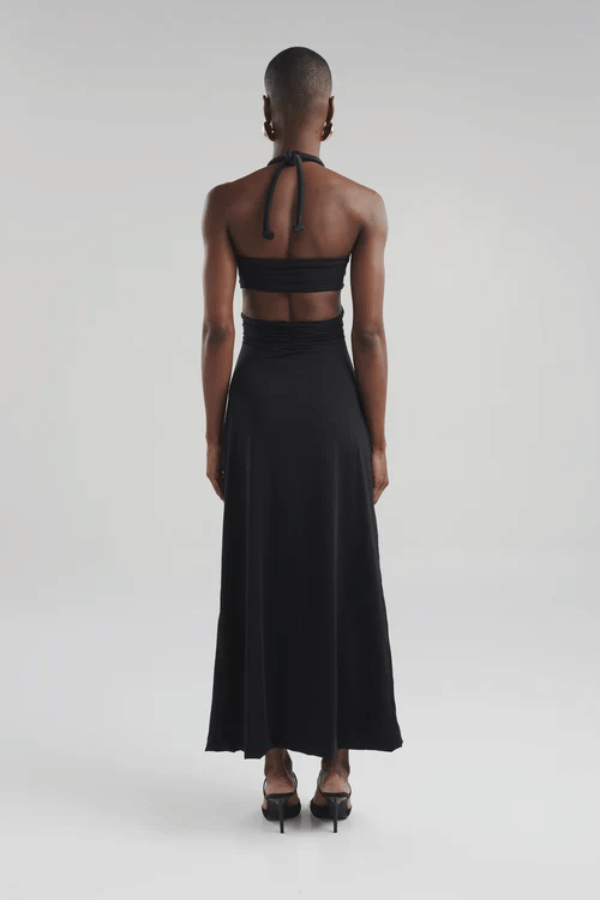 Migramah Black by Maygel Coronel – Draped dress with handmade knot, waist cutout, and shirred hips for flattering fit.