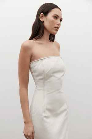 Amiri Denim Dress Angora by Bayse, a trendy, strapless denim dress with a corset-style bodice that sculpts your figure. Perfect for chic day-to-night looks.