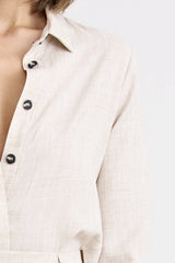Pino Twist Shirt by Pfeiffer — a lightweight natural button-up with a subtle twist front and relaxed drape, perfect for effortless styling.
