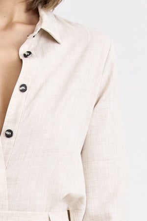 Pino Twist Shirt by Pfeiffer — a lightweight natural button-up with a subtle twist front and relaxed drape, perfect for effortless styling.
