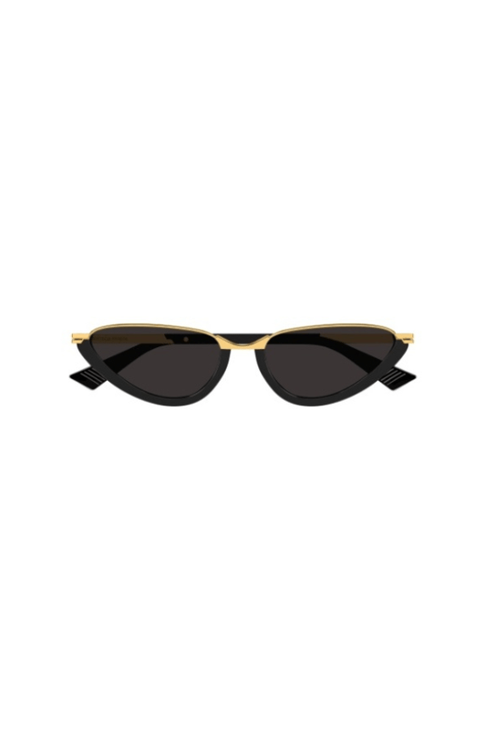 Sunglasses with gold frame and black lenses on a white background