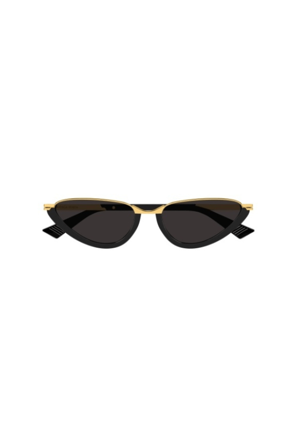 Sunglasses with gold frame and black lenses on a white background