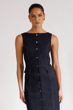 Good Vibes Midi Indigo by Pasduchas – Trendy stretch denim midi with contrast stitching, gold snaps, and tailored pockets, perfect for sleek day-to-night style.