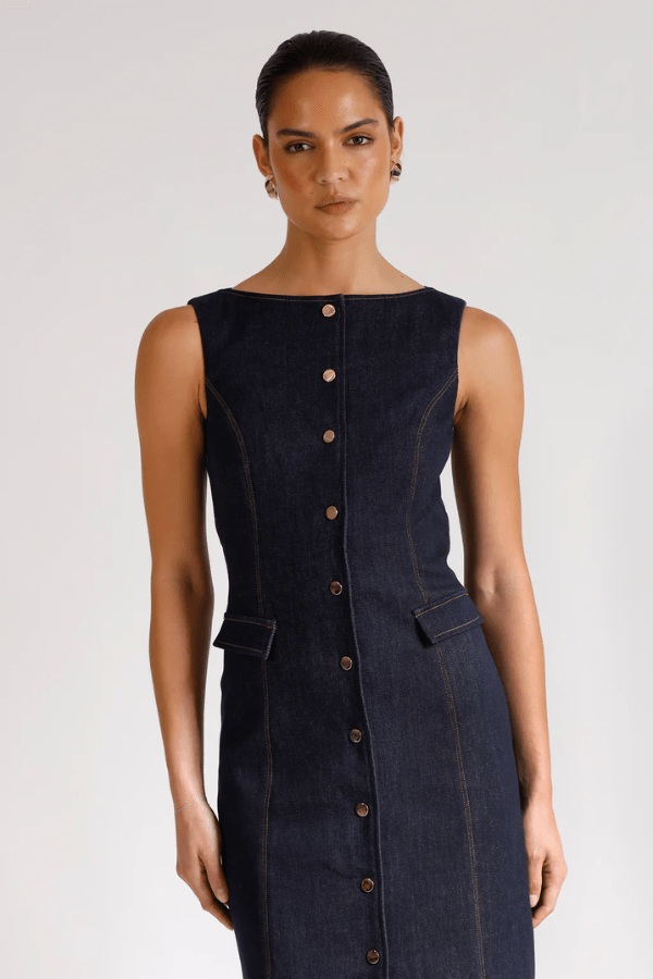 Good Vibes Midi Indigo by Pasduchas – Trendy stretch denim midi with contrast stitching, gold snaps, and tailored pockets, perfect for sleek day-to-night style.