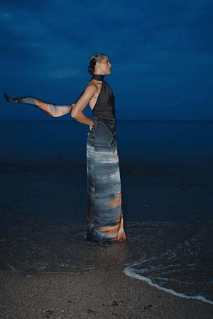 Ari Dress Tigre by Baobab – A bold, elegant one-shoulder maxi with ruched texture and scarf accent, perfect for making a trendy statement at evening events.