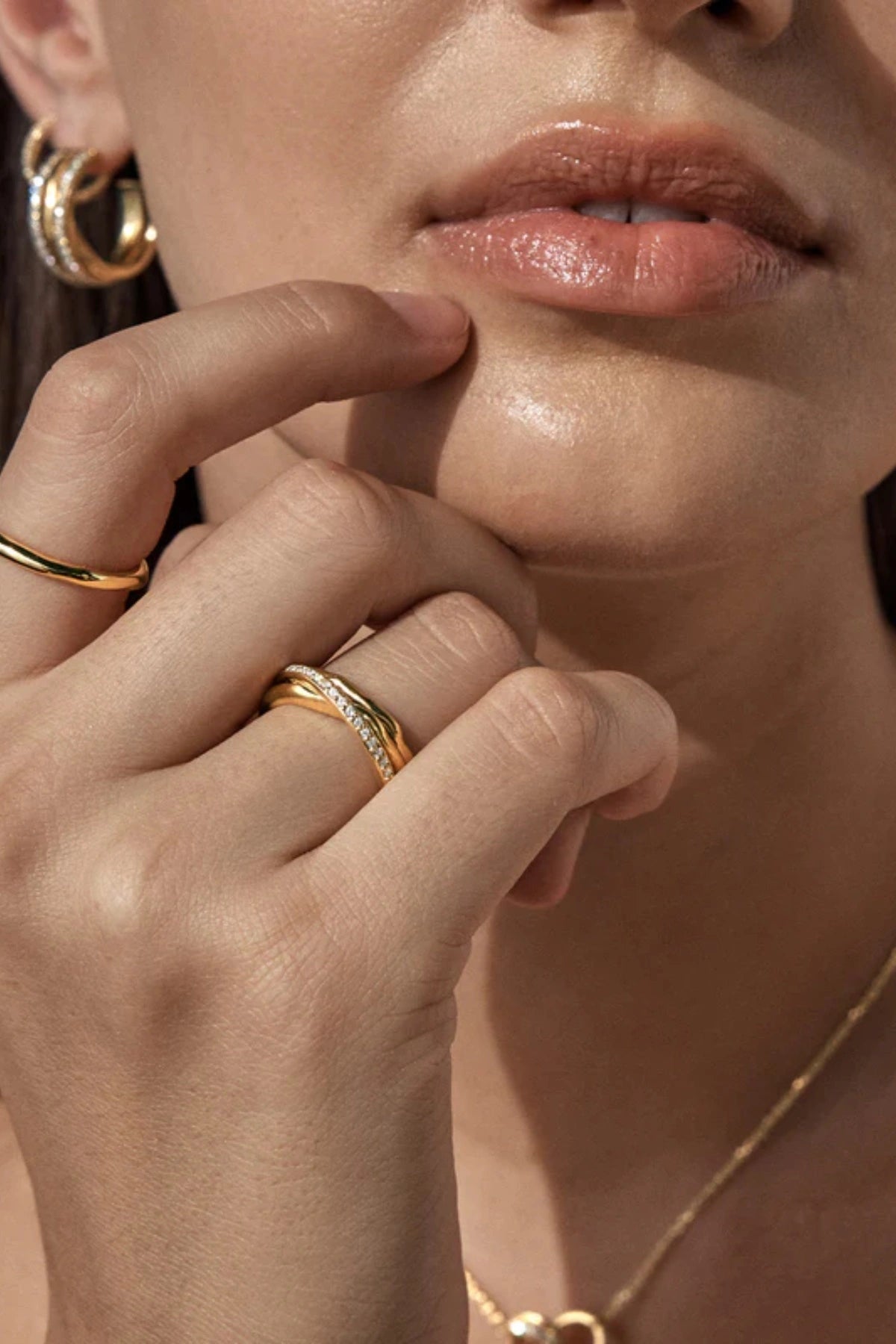 Entwined Hearts Ring by By Charlotte — a sterling silver double-band ring with CZ crystals, symbolising intertwined love and timeless elegance.