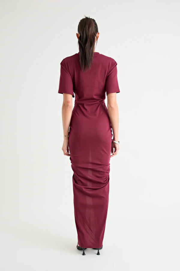 Niko Maxi Dress Burgundy by Pfeiffer – Trendy relaxed T-shirt maxi with adjustable side ruching, crew neck, and breathable cotton blend, perfect for elevated off-duty style and everyday comfort.