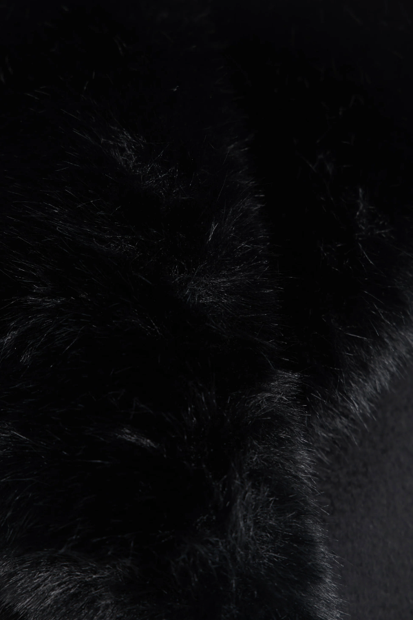 Biera Coat Black by Rebecca Vallance – A boxy, double-breasted wool coat with flap pockets, embossed dome buttons, and removable faux fur trim. Fully lined for comfort.