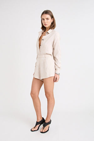 Pino Tailored Short by Pfeiffer — a lightweight mid-rise short with a curved hem and clean tailored finish, ideal for polished daytime looks.
