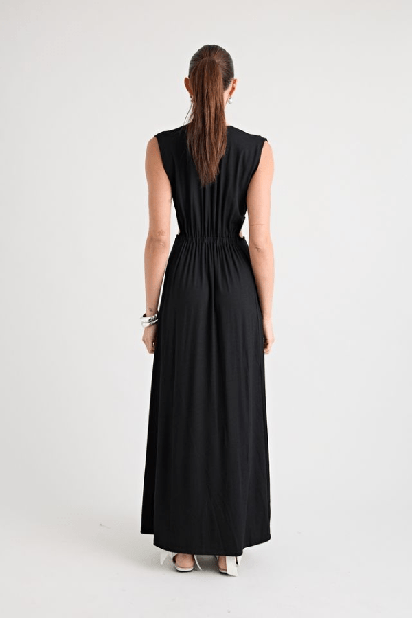 Do For Love Gown Black by Pfeiffer – A trendy, elegant low-plunge maxi with bold hardware and thigh-high split, perfect for special occasions and modern sophistication.
