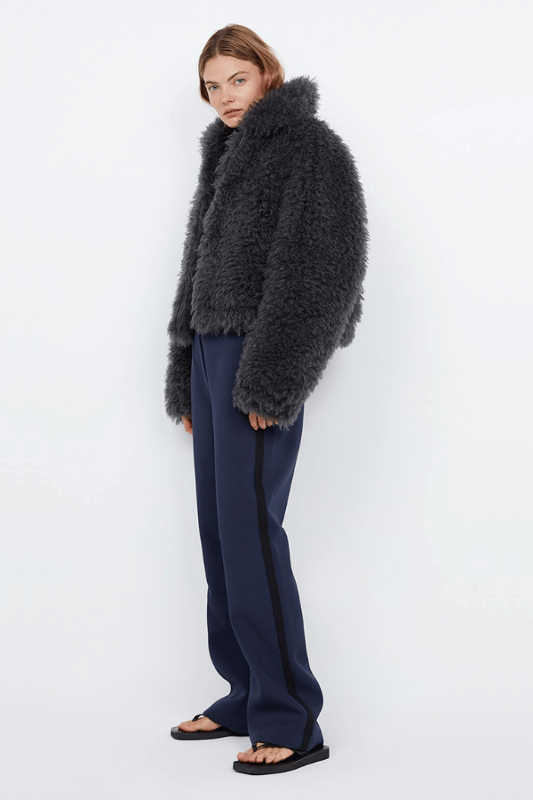 Argo Jacket Charcoal by Bec + Bridge – A chic charcoal faux fur bomber with wide collar, relaxed fit, front hook closure, and low waist finish. Fully lined. Dry clean only.