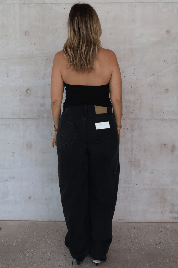 Bella Halter Tank Black by Sneaky Link – A chic, breathable cotton-spandex tank with a deep scoop neckline and open back, perfect for layering or solo wear.