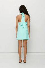 Inka Vest Dress Aqua by The Wolf Gang, a tailored mini with halter neckline and custom hardware. Perfect for bold day-to-night dressing.