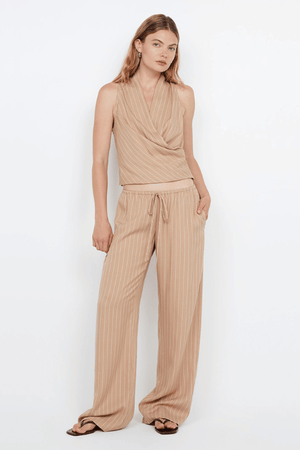 Almeria Wrap Top Camel Stripe by Bec + Bridge – Trendy wrap top with draped V-neck and racer back, perfect for effortless warm-weather elegance and viral summer looks.