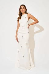 Crystal Maxi Dress by Odd Muse, a white bridal maxi with crystal and pearl detailing, high neckline and elegant fitted silhouette.
