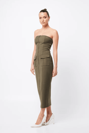 Low Profile Midi Dress Khaki by Mossman – A chic, strapless utility-inspired midi with exposed zip, front pockets, and back split, perfect for modern, versatile styling.